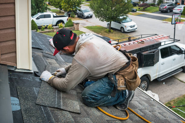 Professional Roof Replacement technician working in Teaneck, NJ